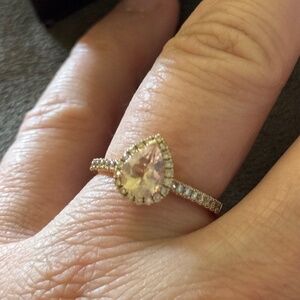 A beautiful moissanite 1/3 carat diamond 14 karat strawberry gold